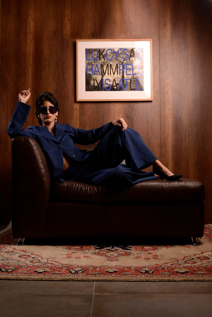 Confident woman in navy suit by Nena Cavalieri, Florence studio
