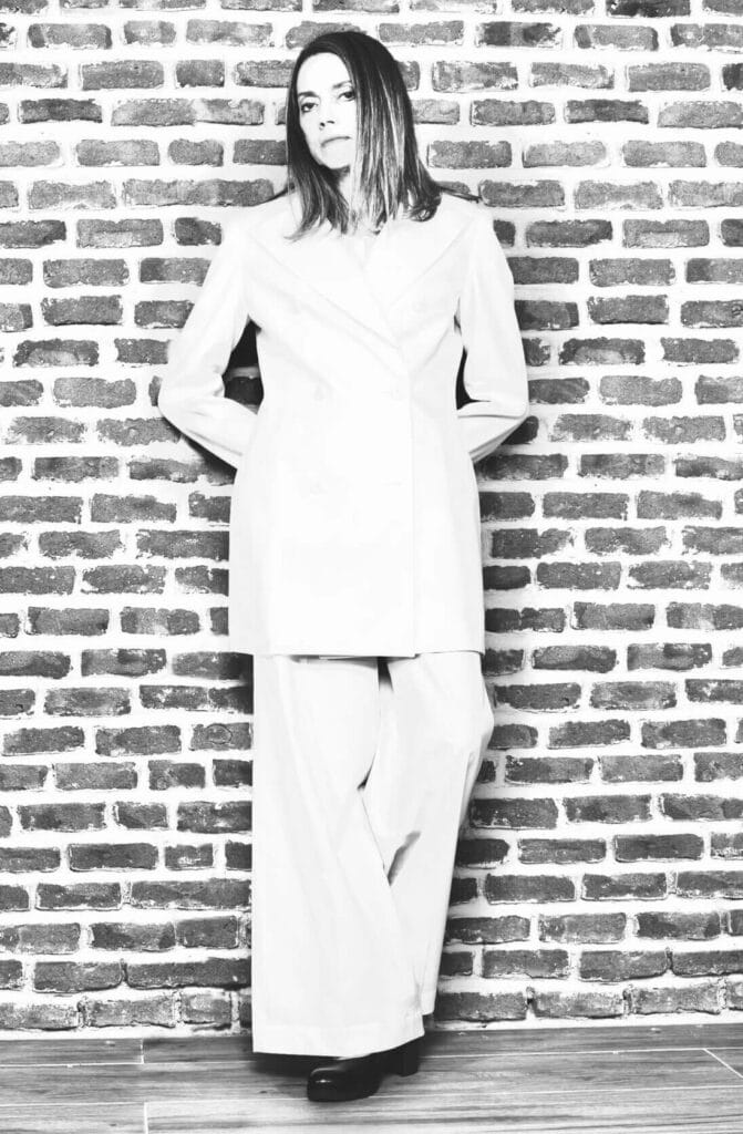 Designer portrait in white suit, Nena Cavalieri Florence