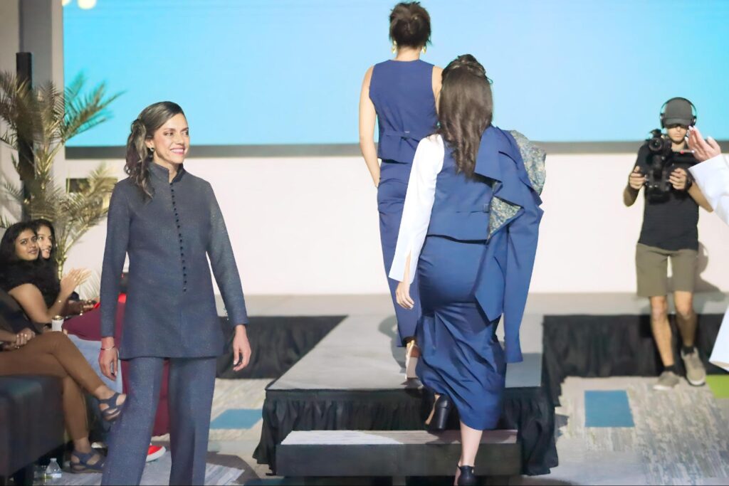 Nena Cavalieri models on the runway at fashion event